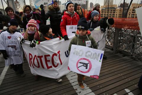 Participants with One Million Moms for Gun Control march across the Brooklyn Bridge on January 21. Spencer Platt/Getty Images Spencer Platt/Getty Images