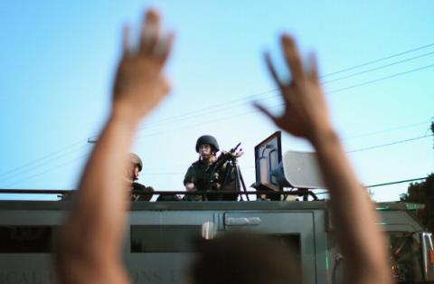 Police train guns over protest of the shooting death of Michael Brown on Aug. 13 in Ferguson, Mo. Scott Olson/Getty Images Scott Olson/Getty Images