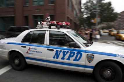 An NYPD car drives through the streets of New York City. Photo via RNS/courtesy Giacomo Barbaro via Flickr