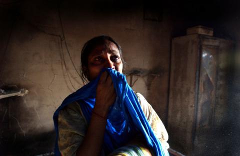 Woman whose house burned in Hindu-Muslim violence in Pakistan.Ami Vitale/Getty Images Ami Vitale/Getty Images