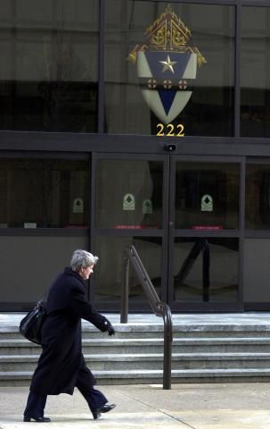 Pedestrian walks past the Archdiocese of Philadelphia headquarters. Photo by William Thomas Cain/Getty Images Photo by William Thomas Cain/Getty Images