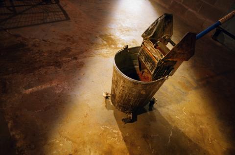 Custodian mop bucket, Design Pics/Darren Greenwood / Getty Images Custodian mop bucket, Design Pics/Darren Greenwood / Getty Images