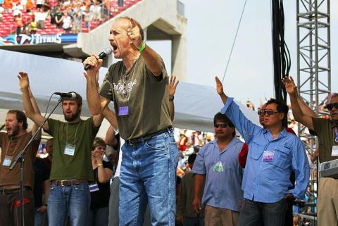 Lou Engel (center with mic) at the Call Nashville event in 2007. Image via Wiki Commons. Lou Engel (center with mic) at the Call Nashville event in 2007. Image via Wiki