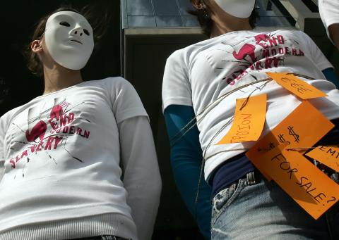 Amnesty International members protest human trafficking, 2008. LOUISA GOULIAMAKI/AFP/Getty Images. LOUISA GOULIAMAKI/AFP/Getty Images