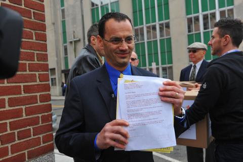 Nicholas Coppola delivers 18,603 signatures, asking to be active in his Roman Catholic parish. Photo courtesy RNS/GLAAD.