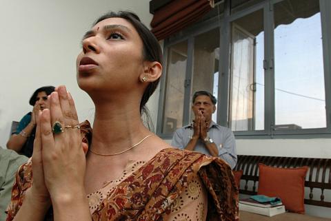 A woman chanting at Bharat Soka Gakkai. Image by The India Today Group/Getty Images. A woman chanting at Bharat Soka Gakkai. Image by The India Today Group/Getty Ima