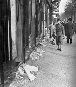 A boy cleans the street after Kristallnacht in November 1938. Photo courtesy Wikimedia Commons/Public Domain. Via RNS