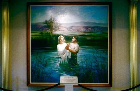 A painting of John the Baptist baptizing Jesus at the LDS visitor center in Salt Lake. Photo by Jason Andrew/Getty Images.