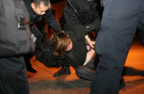 A protester from Occupy Oakland is arrested in Oakland on January 28, 2012. Photo via Getty Images. Occupy Oakland protester is arrested 1/28/12. Image via Getty Images.