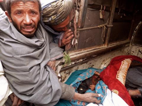 A mourner cries over the bodies of Afghan civilians, allegedly shot by a rogue US soldier, 3/11/12JANGIR/AFP/Getty Images