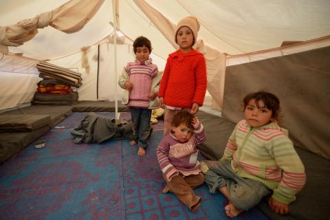 Young children sit inside a tent in the Za’atari refugee camp. Jeff J Mitchell/Getty Images Jeff J Mitchell/Getty Images