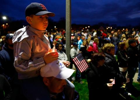Young boy atop father's shoulders at vigil for Martin Richard, victim of Boston bombing. Jared Wickerham/Getty Images Jared Wickerham/Getty Images