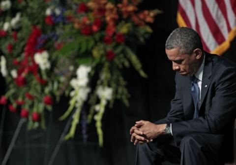 President Obama bows his head at the West memorial service held at Baylor University April 25. Erich Schlegel/Getty Images Erich Schlegel/Getty Images