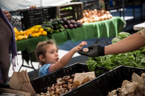 A girl pays for her mother's groceries using Electronic Benefits Transfer (EBT) token in New York. Andrew Burton/Getty Images Andrew Burton/Getty Images