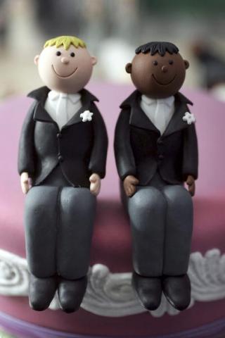Wedding cake topper photo by Christopher Furlong/Getty Images. Wedding cake topper photo by Christopher Furlong/Getty Images.