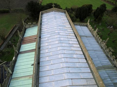 Roof of a church in North Yorkshire, UK, where new copper panels replace those stolen by thieves. Getty Images. Photo via Getty Images.