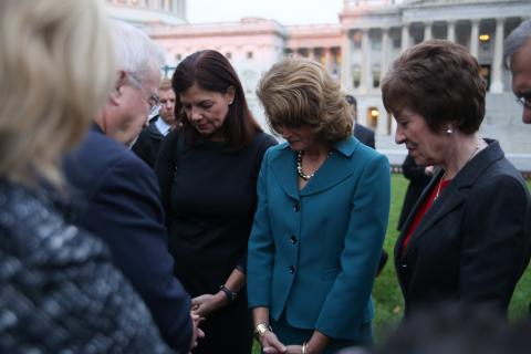 Jim Wallis prays with members of Congress during the #FaithfulFilibuster and the government shutdown. Brandon Hook/Sojourners