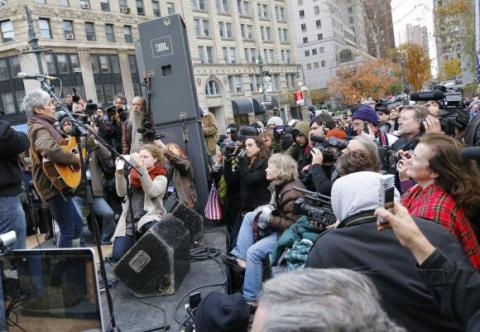 Joan Baez performs for Occupy Wall Street. Image from ph.cdn.photos.upi.com Joan Baez performs for Occupy Wall Street. Image from ph.cdn.photos.upi.com