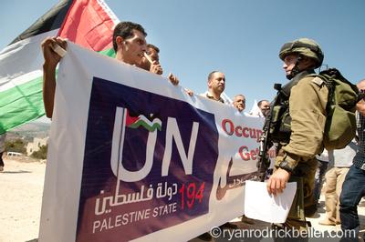 Protesters supporting Palestinian statehood confront Israeli soldiers in the West Bank village of Al-Walaja on Sept. 16. Photo by Ryan Rodrick Beiler