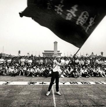 A man waves a flag in May 1989 at China’s Tiananmen Square. Creative Commons image by Robert Croma