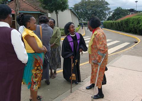 Pastor Dawn Gikandi, center, speaks with women at the Bahati Martyrs’ Church in Nairobi. RNS photo by Fredrick Nzwili.