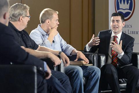 Ethics & Religious Liberty Commission President Russell Moore, right, leads a June 9, 2014 panel. RNS photo courtesy Paul W. Lee