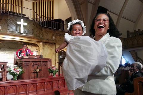 Rev. Leslie Callahan, pastor of Philadelphia’s St. Paul’s Baptist Church, holds her daughter Bella. Courtesy Leslie Callahan.