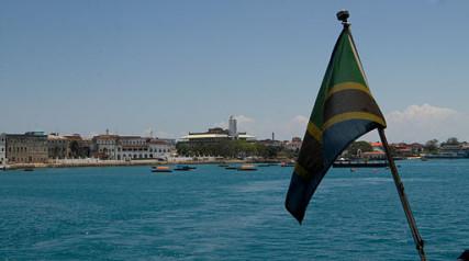 View of Stone Town, Zanzibar, with the Zanzibar flag in the foreground. Photo courtesy Fanny Schertzer, via WikimediaCommons/RNS