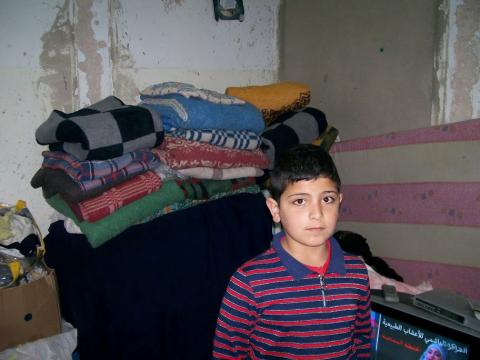 Syrian boy in rented flat in Mafraq, Jordan. MCC Photo/Nada Zabeneh Syrian boy in rented flat in Mafraq, Jordan. MCC Photo/Nada Zabeneh