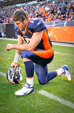 Tim Tebow taking a knee. Photo Courtesy RNS/Wikipedia Photo Courtesy RNS/Wikipedia