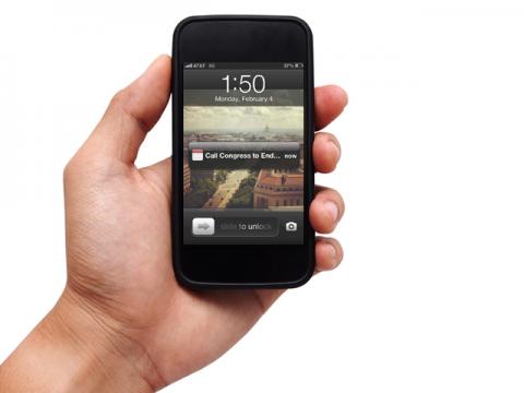 Hand holding smart phone. Chardchanin / Shutterstock.com Chardchanin / Shutterstock.com