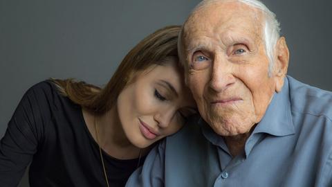 Angelina Jolie with Louis Zamperini. Photo courtesy of Universal / RNS. Angelina Jolie with Louis Zamperini. Photo courtesy of Universal / RNS.