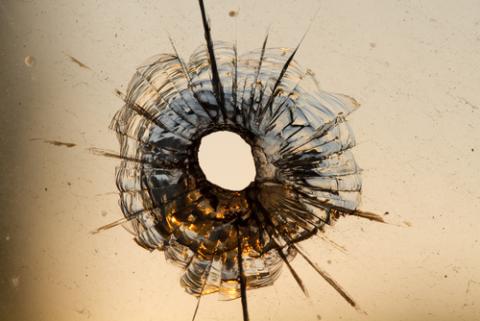 Gun shot in window, Iurii Konoval / Shutterstock.com Gun shot in window, Iurii Konoval / Shutterstock.com