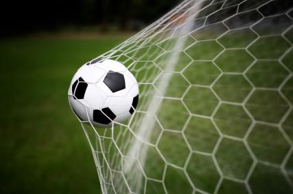 Soccer ball in goal. Photo Courtesy RNS/Shutterstock.com Photo Courtesy RNS/Shutterstock.com