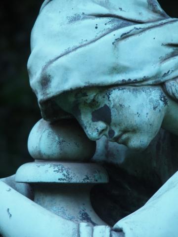 Grave marker showing face of sorrow, Hub.-Wilh. Domroese / Shutterstock.com Grave marker showing face of sorrow, Hub.-Wilh. Domroese / Shutterstock.com