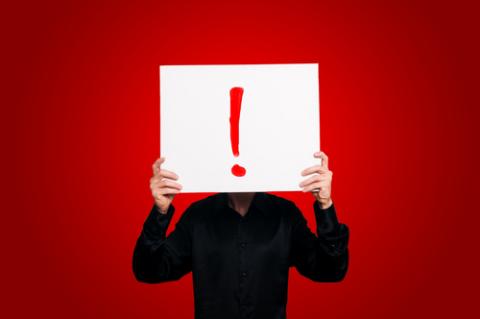 Man Holding Sign Exclamation Eugenio Marongiu / Shutterstock Man Holding Sign Exclamation Eugenio Marongiu / Shutterstock