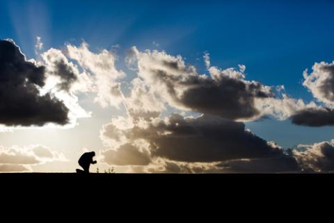 Man praying against cloudy sky, Dayna More / Shutterstock.com Man praying against cloudy sky, Dayna More / Shutterstock.com