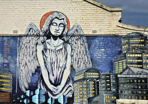 An angel surveys a city. Image courtesy Neale Cousland/shutterstock.com An angel surveys a city. Image courtesy Neale Cousland/shutterstock.com