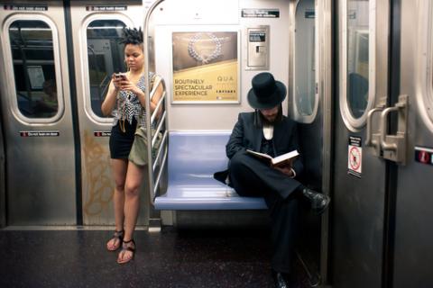 Commuters on subway on June 28, 2012 in New York City. pio3 / Shutterstock.com pio3 / Shutterstock.com
