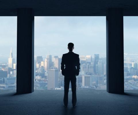 Young man looking on city. Peshkova / Shutterstock.com Peshkova / Shutterstock.com