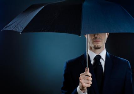 Portrait of a man in a suit with an umbrella. Photo courtesy RNS/Shutterstock.com Photo courtesy RNS/Shutterstock.com