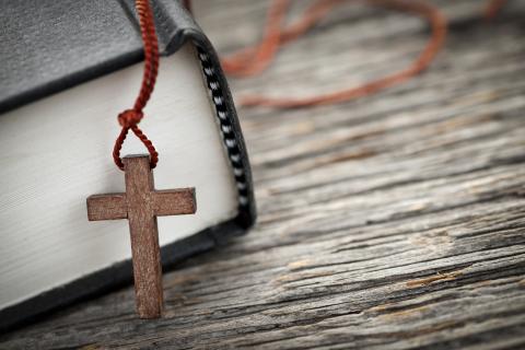 Cross & hymnal, Elena Elisseeva / Shutterstock.com Cross & hymnal, Elena Elisseeva / Shutterstock.com
