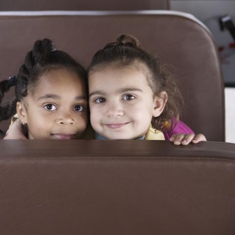 Two young girls on a bus. Image courtesy Blend Images/shutterstock.com. Two young girls on a bus. Image courtesy Blend Images/shutterstock.com.
