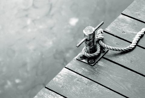 Tied to the dock. Photo via Stockdonkey / Shutterstock.com Photo via Stockdonkey / Shutterstock