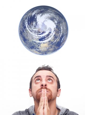 Man praying for the earth, Gandolfo Cannatella / Shutterstock.com Man praying for the earth, Gandolfo Cannatella / Shutterstock.com