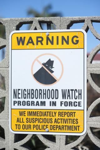 Neighborhood watch sign on a gate. Photo courtesy gabriel12/shutterstock.com Neighborhood watch sign on a gate. Photo courtesy gabriel12/shutterstock.com