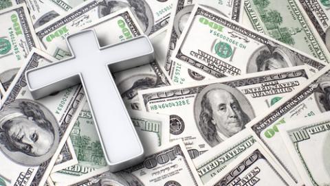 Cross on top of $100 bills, StockThings / Shutterstock.com Cross on top of $100 bills, StockThings / Shutterstock.com
