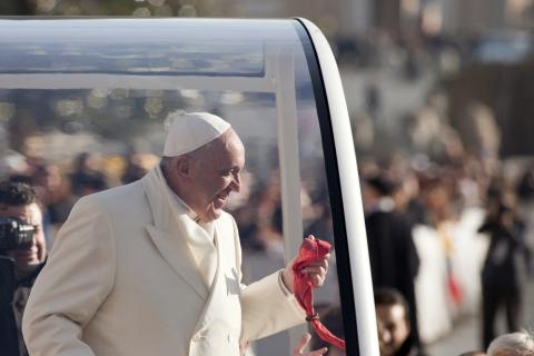 Pope Francis greets people in St. Peter's Square in the Pope mobile. giulio napolitano / Shutterstock.com giulio napolitano / Shutterstock.com