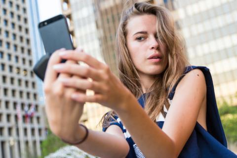 Young woman taking a selfie, Linda Moon / Shutterstock.com Young woman taking a selfie, Linda Moon / Shutterstock.com