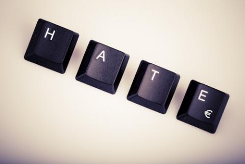The word “hate” formed with computer keyboard keys. Photo courtesy Jaromir Urbanek via Shutterstock